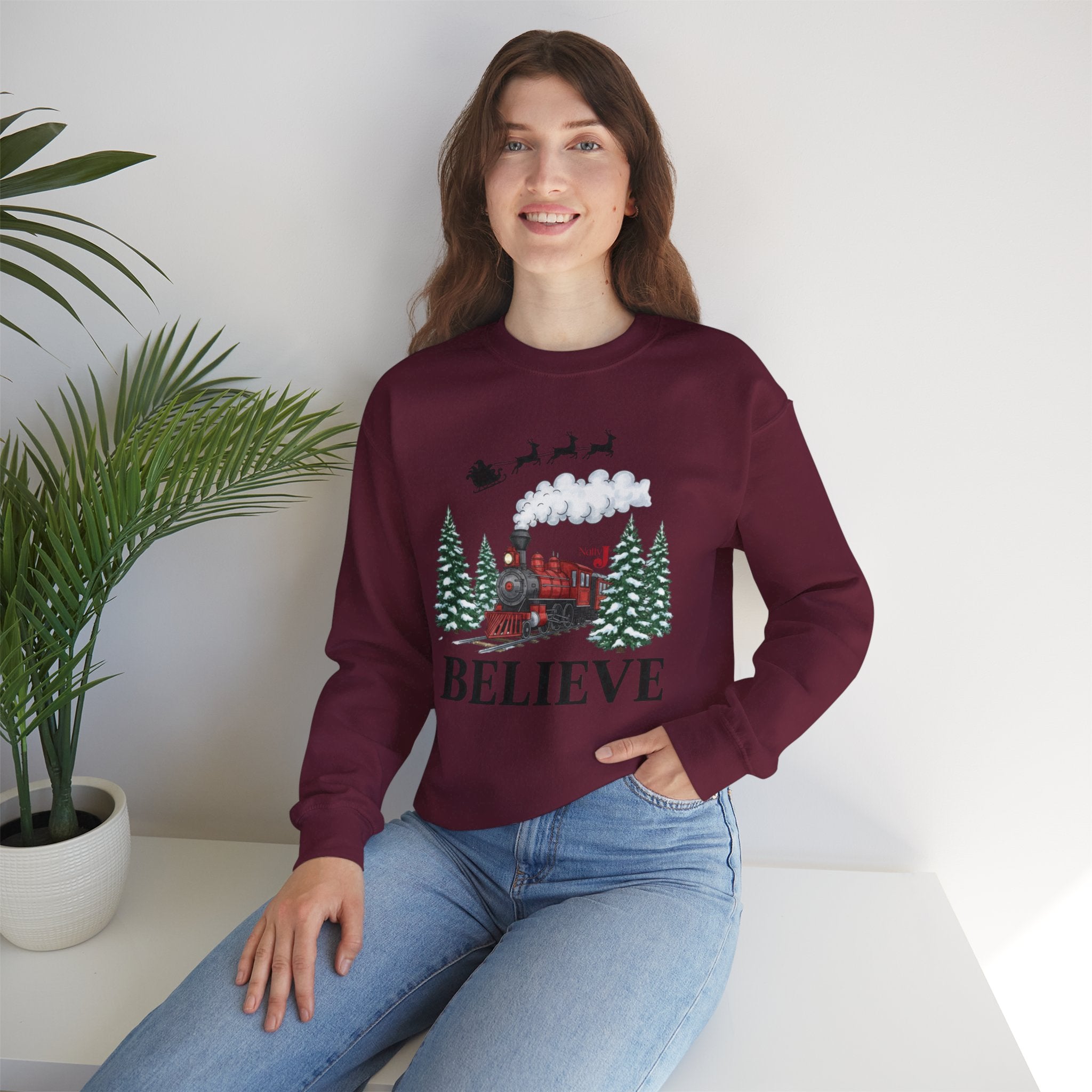 Women’s Believe Christmas Sweatshirt – Festive Holiday Train & Santa Sleigh Crewneck – Cozy Winter Graphic Sweatshirt for Women – Christmas Outfit Top