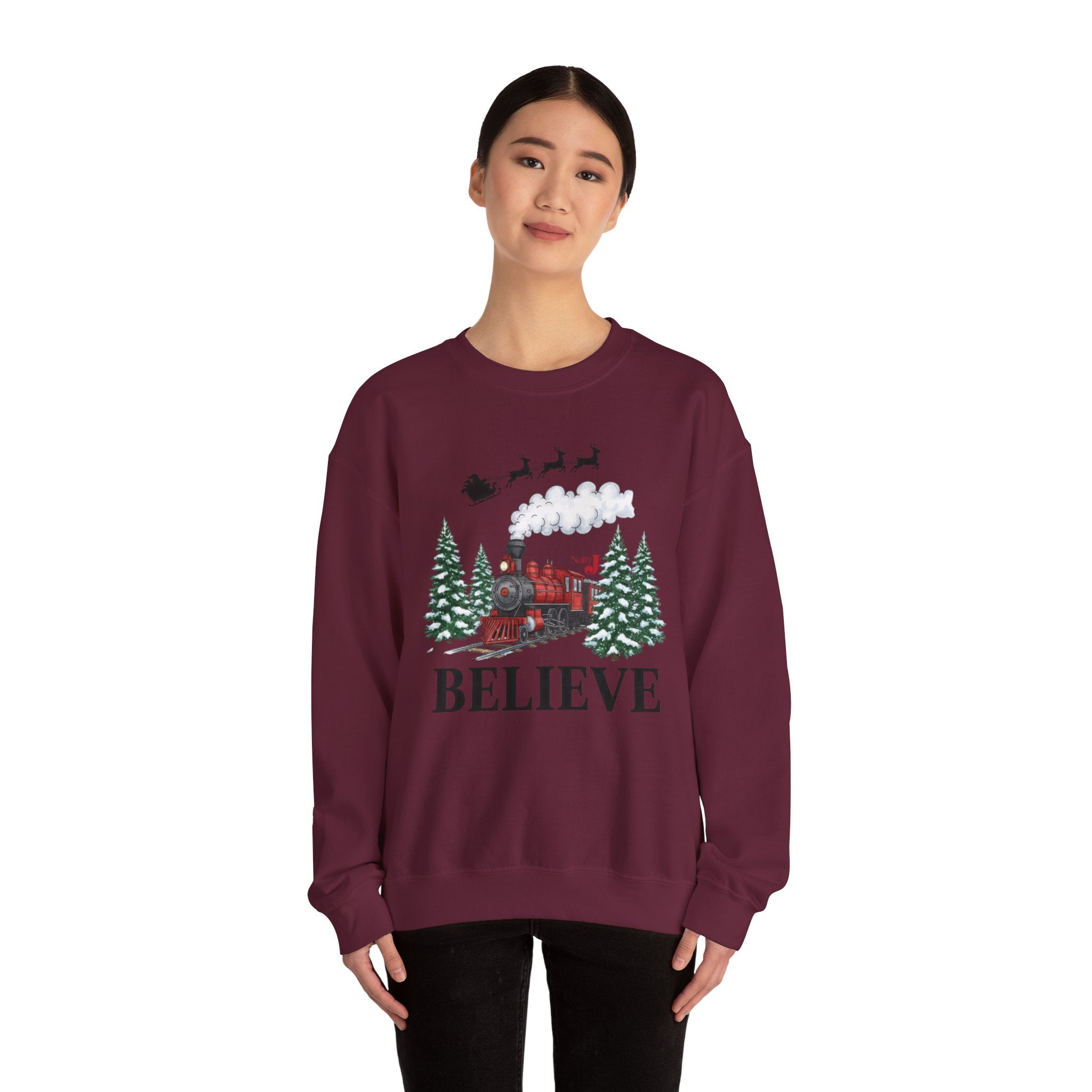 Women’s Believe Christmas Sweatshirt – Festive Holiday Train & Santa Sleigh Crewneck – Cozy Winter Graphic Sweatshirt for Women – Christmas Outfit Top