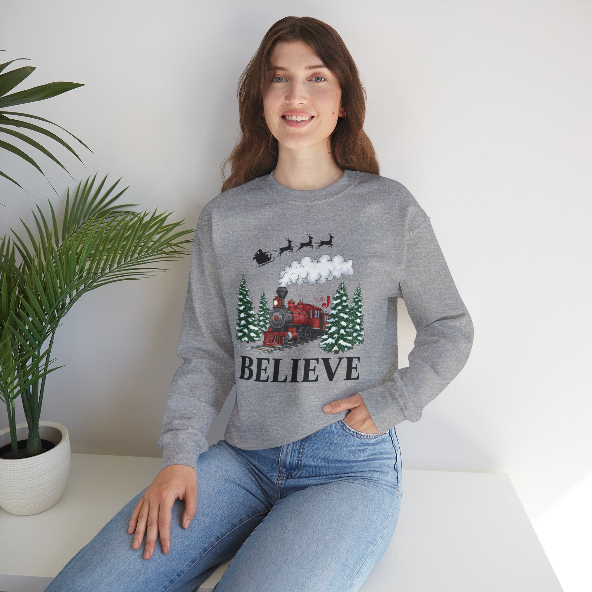 Women’s Believe Christmas Sweatshirt – Festive Holiday Train & Santa Sleigh Crewneck – Cozy Winter Graphic Sweatshirt for Women – Christmas Outfit Top