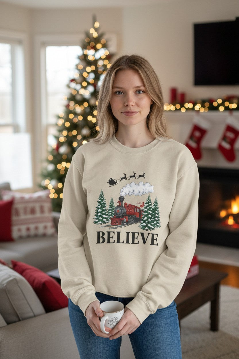 Women’s Believe Christmas Sweatshirt – Festive Holiday Train & Santa Sleigh Crewneck – Cozy Winter Graphic Sweatshirt for Women – Christmas Outfit Top