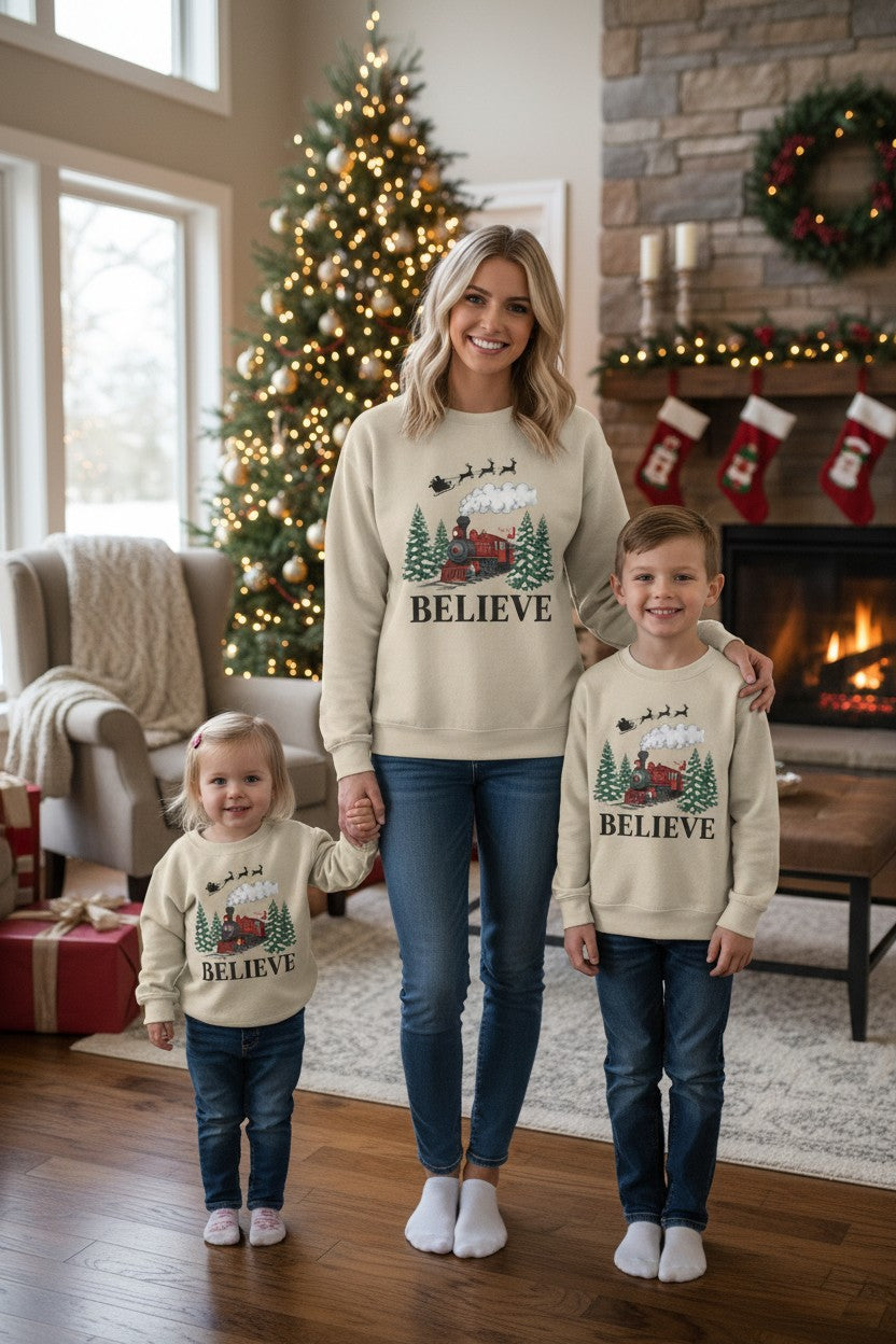 Women’s Believe Christmas Sweatshirt – Festive Holiday Train & Santa Sleigh Crewneck – Cozy Winter Graphic Sweatshirt for Women – Christmas Outfit Top