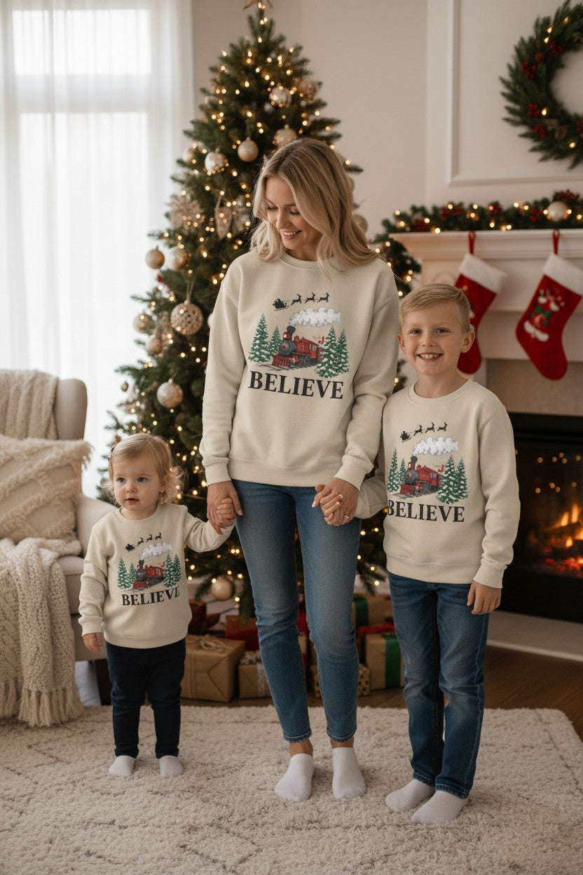Women’s Believe Christmas Sweatshirt – Festive Holiday Train & Santa Sleigh Crewneck – Cozy Winter Graphic Sweatshirt for Women – Christmas Outfit Top