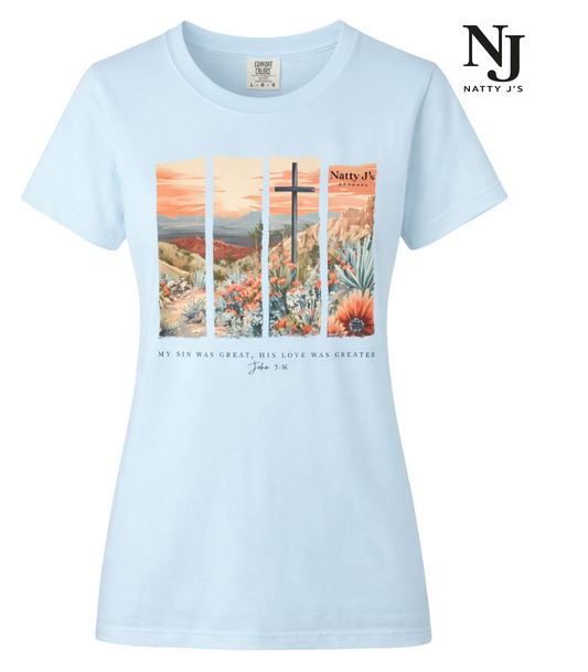 Light blue t-shirt with a scenic design and ' NJ Natty J's' branding on a white background
