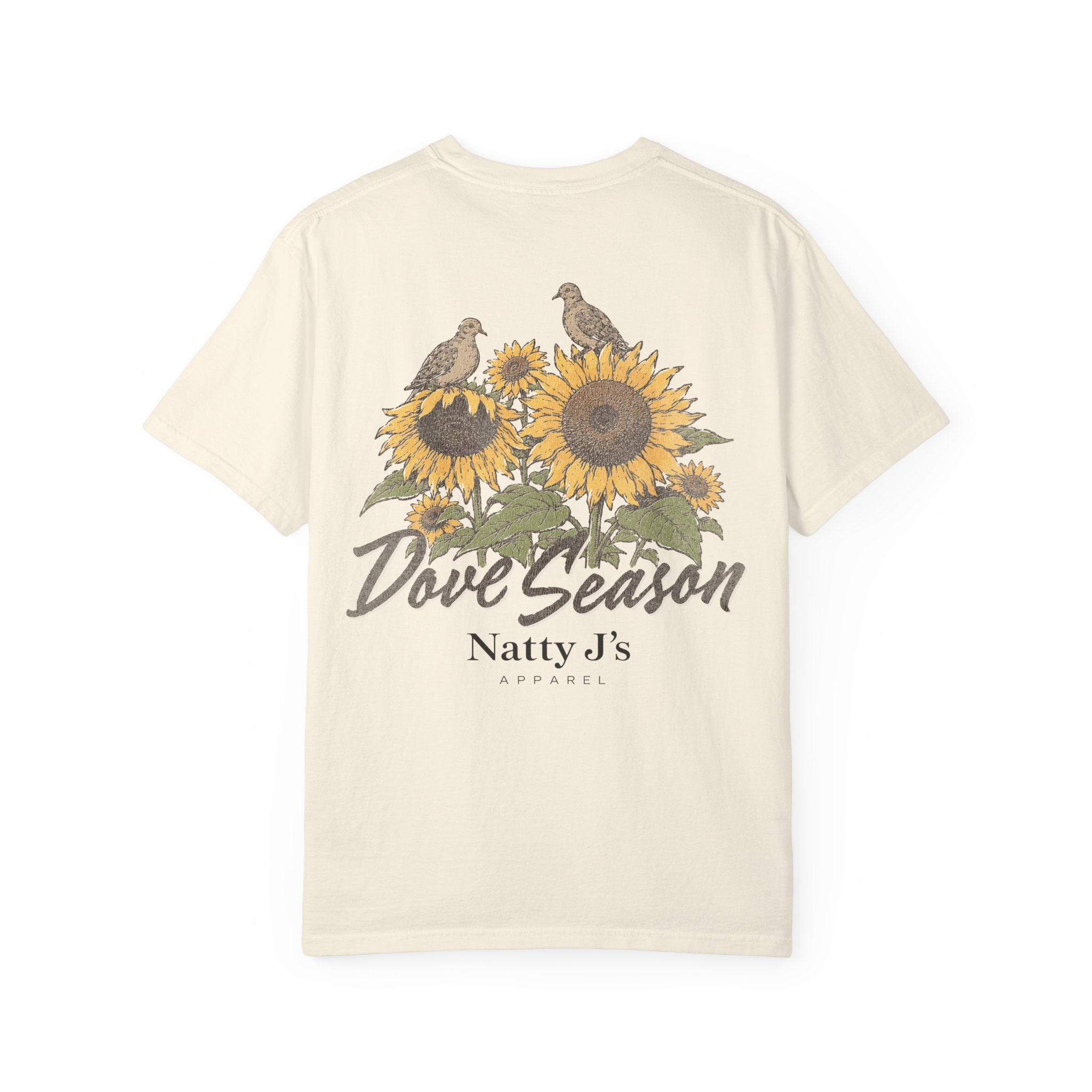 An off-white short-sleeve t-shirt with a vintage-style graphic on the front featuring two birds perched on sunflowers, with the text 'Dove Season' and 'Natty J's APPAREL' printed below.