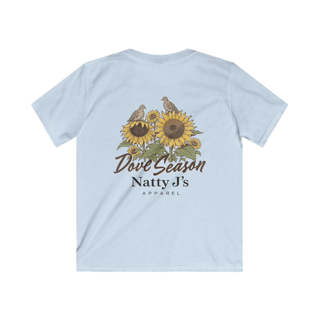 A light blue short-sleeve t-shirt shown from the back, featuring a graphic print of two birds perched on sunflowers with the text 'Dove Season Natty J's APPAREL' in brown.