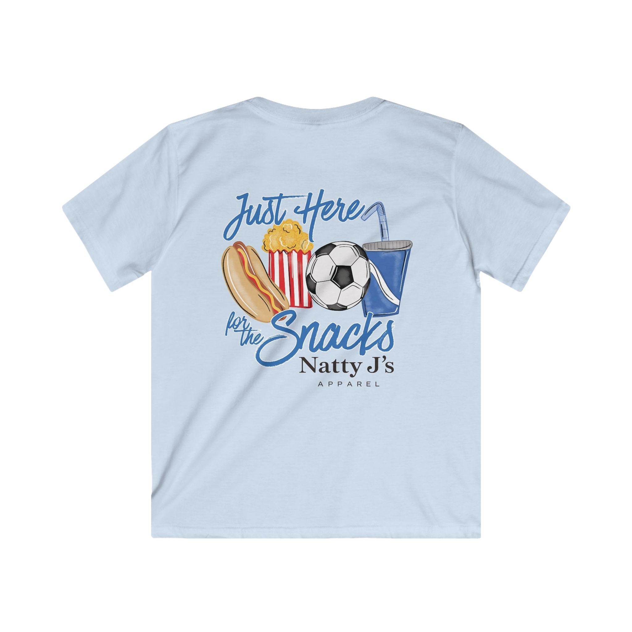A light blue short-sleeve t-shirt shown from the back, featuring a colorful graphic print of a hot dog, popcorn, soccer ball, and drink with the text 'Just Here for the Snacks' and 'Natty J's APPAREL'.