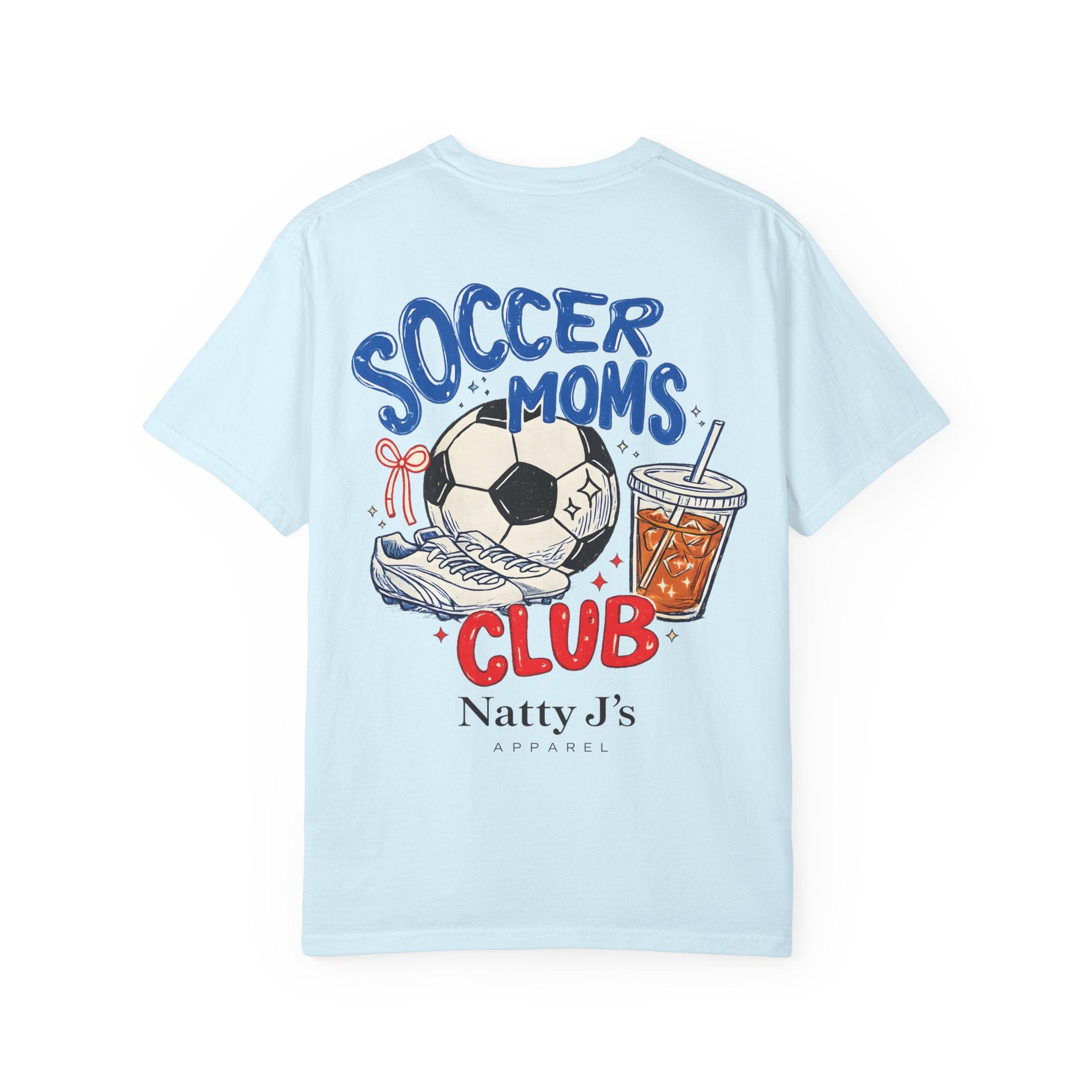 A light blue short-sleeve t-shirt with a colorful graphic on the back featuring a soccer ball, sneaker, drink, and the text 'SOCCER MOMS CLUB' and 'Natty J's APPAREL'.