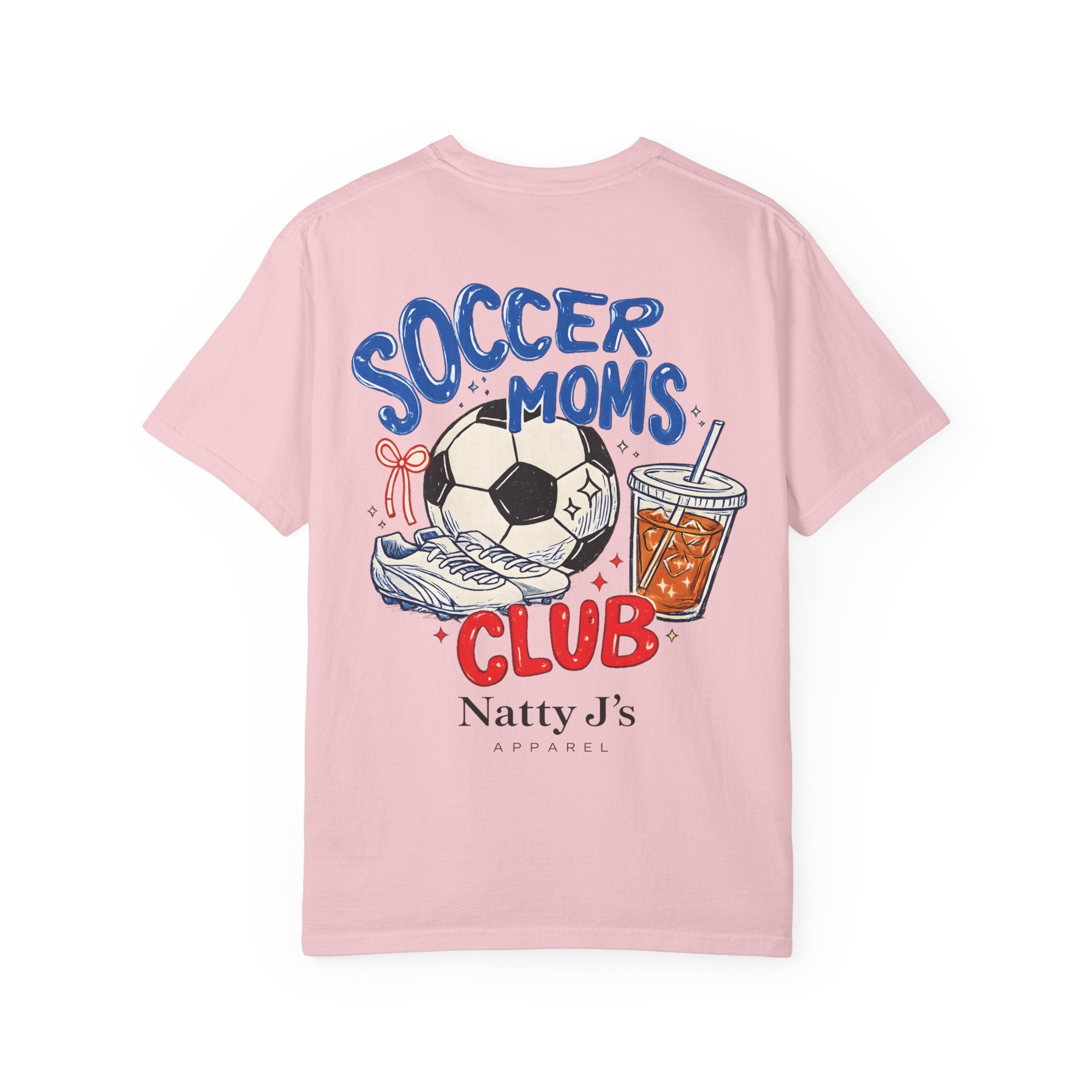 A light pink short-sleeve t-shirt with a colorful graphic on the front featuring a soccer ball, sneaker, drink, and the text 'SOCCER MOMS CLUB' and 'Natty J's APPAREL'.