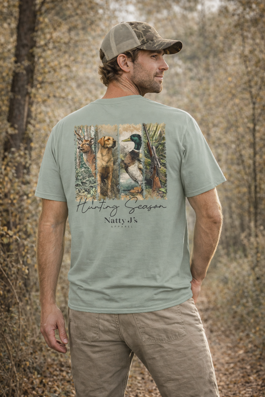 Man wearing a t-shirt with a hunting-themed design in a forest setting