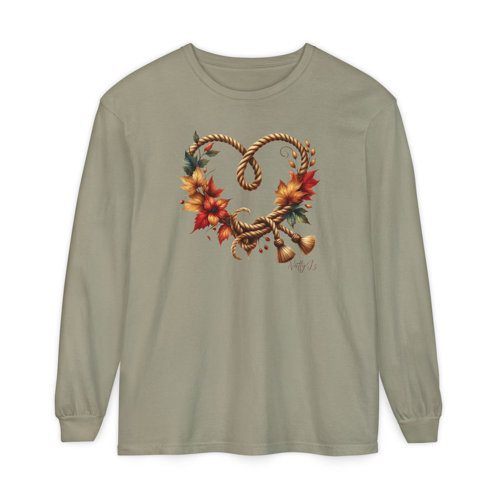 A sage green long-sleeve t-shirt with a central graphic of autumn leaves, rope, and small bells forming a heart shape, displayed on a clean white background.