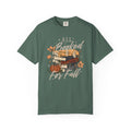 A dark green crewneck t-shirt featuring a graphic of a stack of books, a small pumpkin, and autumn leaves with the text 'ALL Booked For Fall' in a stylized font, displayed on a clean white background.